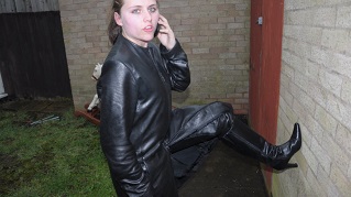 Lucy-girl-in-leather-boots-pants-and-leather-jacket