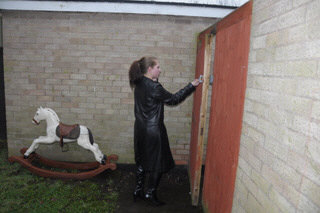 girl-in-leather-jacket-long-leather-boots-on-phone