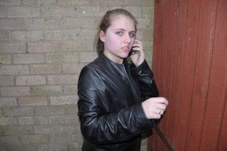 girl-in-leather-jacket-long-leather-boots-on-phone