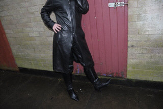 girl-in-leather-jacket-long-leather-boots-on-phone