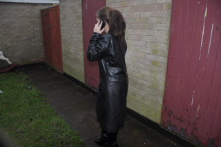 girl-in-leather-jacket-long-leather-boots-on-phone