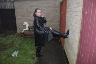 girl-in-leather-jacket-long-leather-boots-on-phone