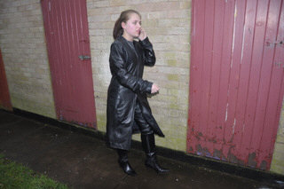 girl-in-leather-jacket-long-leather-boots-on-phone