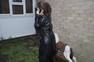 girl-in-leather-jacket-long-leather-boots-on-phone