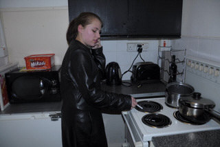 girl-in-leather-jacket-long-leather-boots-on-phone