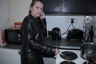 girl-in-leather-jacket-long-leather-boots-on-phone