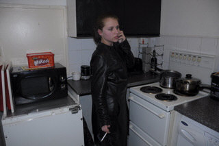 girl-in-leather-jacket-long-leather-boots-on-phone