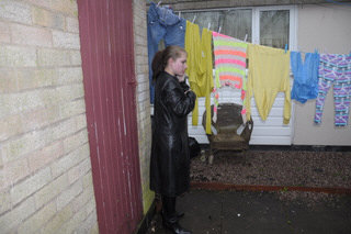 girl-in-leather-jacket-long-leather-boots-on-phone