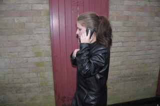 girl-in-leather-jacket-long-leather-boots-on-phone