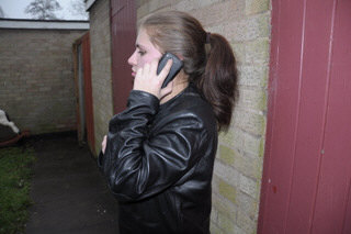 girl-in-leather-jacket-long-leather-boots-on-phone