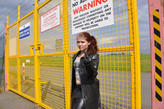 girl-in-leather-pants-leather-gloves-outside-garden