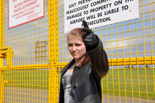 girl-in-leather-pants-leather-gloves-outside-garden