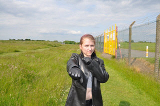 girl-in-leather-pants-leather-gloves-outside-garden