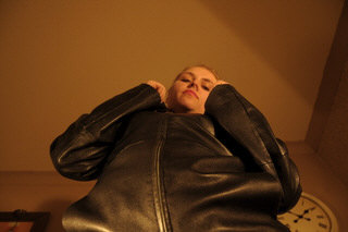 girl-leather-glove-fist-knuckles-tight-grey-room-