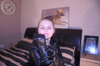 girl-leather-glove-fist-knuckles-tight-grey-room-