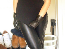 Girl-in-leather-gloves-with-gun-leather-jacket-overknee-leather-boots