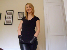 Girl-in-leather-gloves-with-gun-leather-jacket-overknee-leather-boots