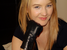 Girl-in-leather-gloves-with-gun-leather-jacket-overknee-leather-boots