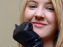 Girl-in-leather-gloves-with-gun-leather-jacket-overknee-leather-boots