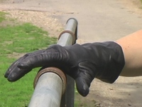 Girl-in-leather-pants-and-leather-gloves-with-jacket-and-boots