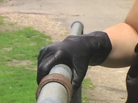 Girl-in-leather-pants-and-leather-gloves-with-jacket-and-boots