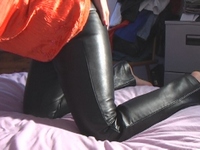 Girl-in-leather-pants-and-leather-gloves-with-jacket-and-boots