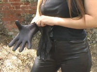 Girl-in-leather-pants-and-leather-gloves-with-jacket-and-boots