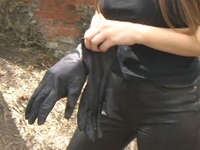 Girl-in-leather-pants-and-leather-gloves-with-jacket-and-boots