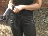 Girl-in-leather-pants-and-leather-gloves-with-jacket-and-boots