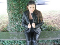 Girl-in-leather-pants-and-leather-gloves-with-jacket-and-boots